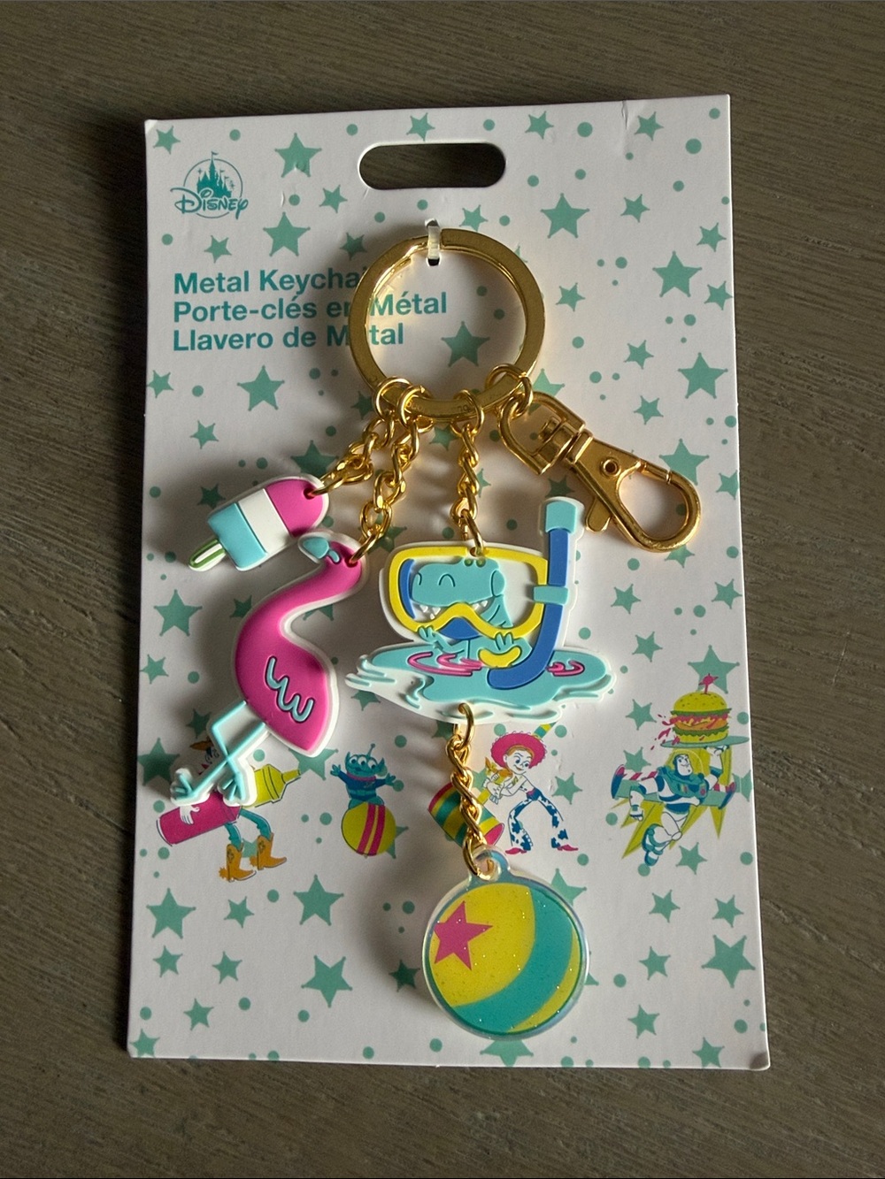 Disney Gold-Tone Keyring with Pink, Teal & Yellow Tropical Charms